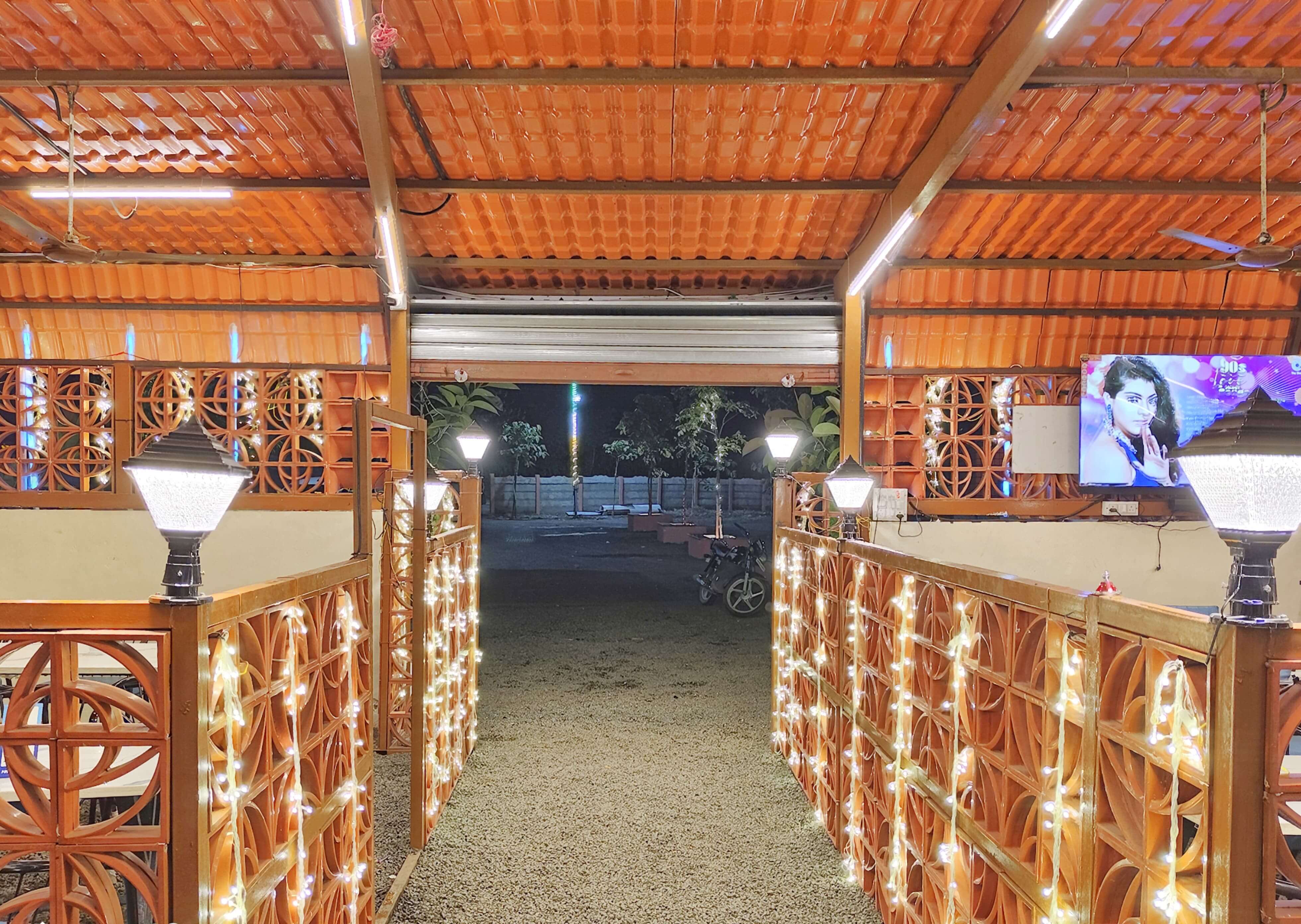 Roadside advertisement signs for Pranav Restro and Bar